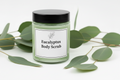 9oz Eucalyptus Body Scrub with smooth texture in clear jar with black lid and white label